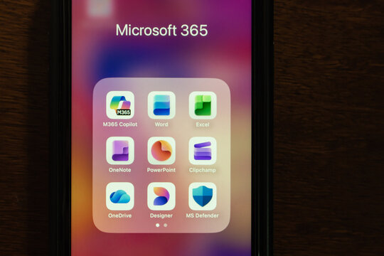 Quito, ECUADOR - Oct 13 2025 : Microsoft 365 app folder containing M365 Copilot, Word, Excel, OneNote, PowerPoint, Clipchamp, OneDrive, Designer, and MS Defender app icons.