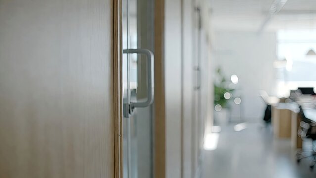 Modern blurred office interior background with soft focus on door handle ideal for business and corporate themes