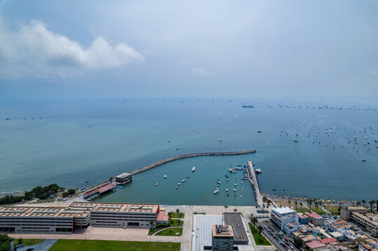 Aerial view of the coastal district of La Punta with its harbor, boats, and buildings in La Punta, Callao Region, Peru.