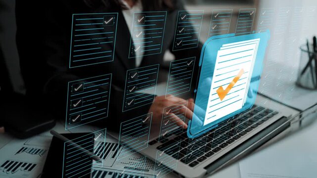 Professional office setting with digital checklist and document management concept displayed on laptop screen in modern workspace. Entropy.