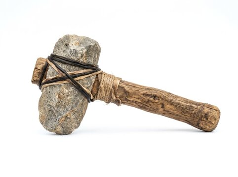 An ancient stone axe with a wooden handle, tied together with rope and fabric. This tool represents early human ingenuity and survival