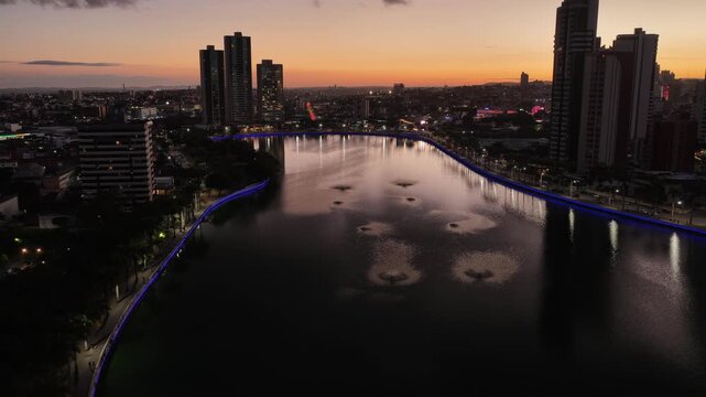 Sunset Campina Grande Skyline In Campina Grande Paraiba Brazil. Drone Captures A Garden With Sidewalks Surrounded By Lush Trees. Building Industrial Skyline Skyscrapers Awesome.