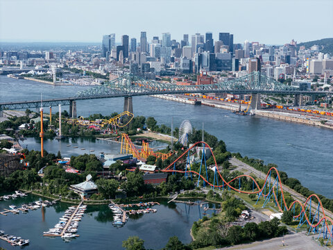 Aerial view of Montreal skyline, Jacques Cartier Bridge and La Ronde amusement island on St Lawrence River. g.