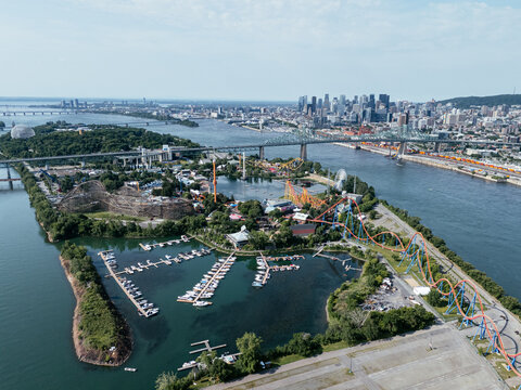 Aerial view of Montreal skyline, Jacques Cartier Bridge and La Ronde amusement island on St Lawrence River. g.