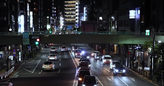 A night cityscape of traffic jam at the downtown crossing in Tokyo telephoto shot