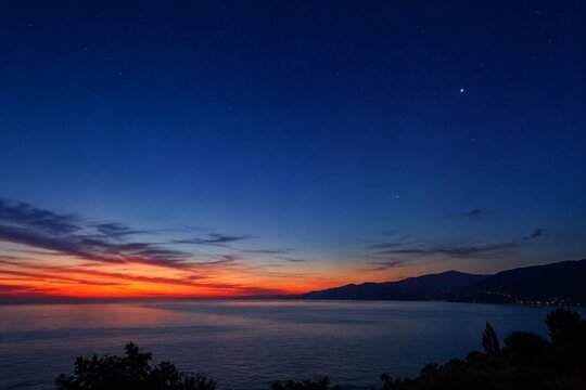 Deep blue twilight sky with the last sunset glow and first stars.
