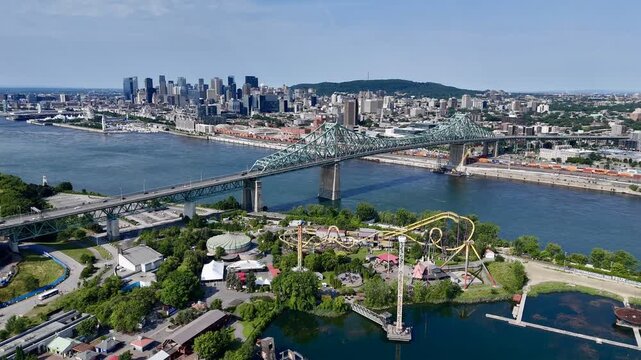 Aerial view of Montreal skyline, Jacques Cartier Bridge and La Ronde amusement island on St Lawrence River. g.