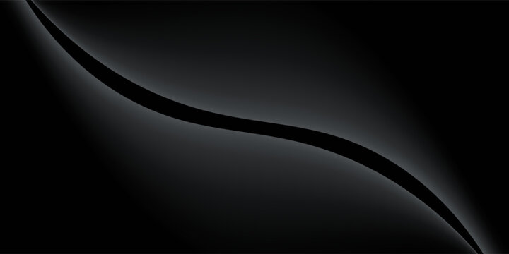 Sandblasted or brushed titanium or steel metal surface, the light reflection of the curved lines creates a smooth gradation on the dark black metallic background