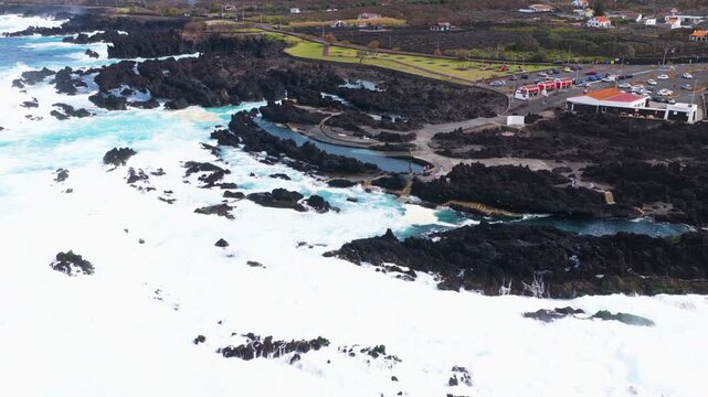 Aerial View Of Waves Crashing Against Piscinas Naturais Biscoitos In Terceira Island, Azores, Portugal.