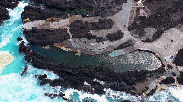 Biscoitos Natural Pools With Volcanic Lava Rock Formations In Terceira Island, Azores, Portugal. - aerial shot