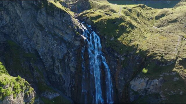 Scenic views of Engstligenalp in the Swiss Alps. Expansive alpine meadows, rugged mountain peaks, dramatic skies and untouched natural landscapes in one of Switzerland's most beautiful alpine regions.