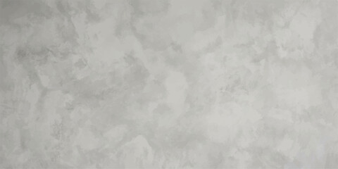 Textured Plaster Wall Surface: A close-up view of a wall featuring a mottled, textured plaster finish in varying shades of gray, offering a subtle, artisanal aesthetic. © Sorna
