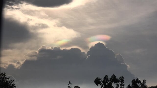 A colorful iridescent pileus cloud, taken after sunset in Thailand.