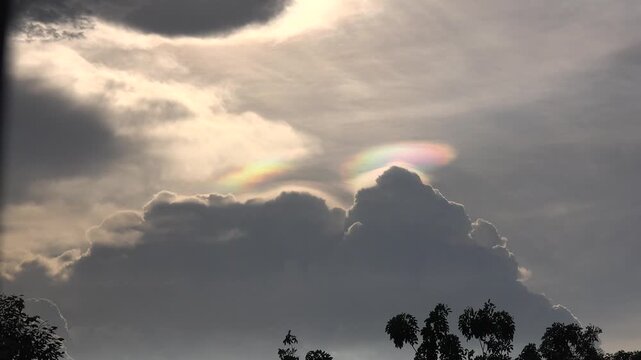 A colorful iridescent pileus cloud, taken after sunset in Thailand.