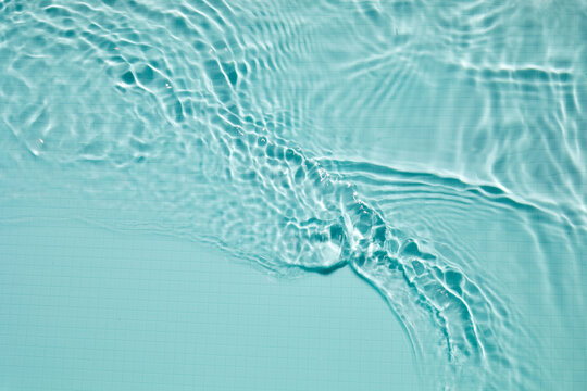 Blue swimming pool water creating ripples and wave patterns