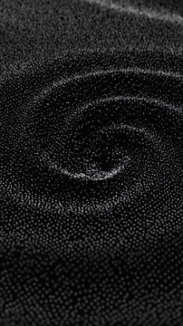 Dark dotted swirl texture in grayscale inspires abstract design