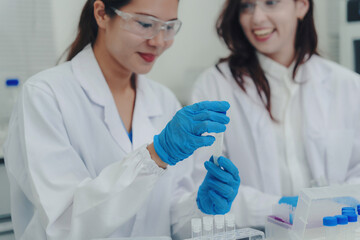 Fototapeta premium Scientists researching in laboratory finding cure