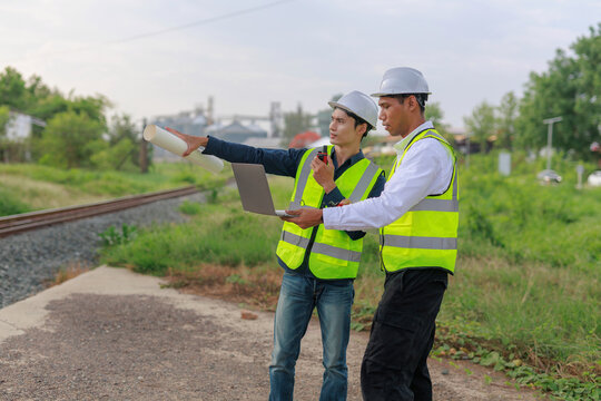 Construction engineers planning railway development project