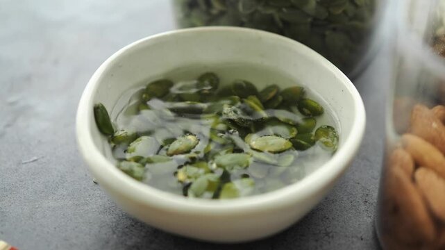 Preparing soaked pumpkin seeds for healthy snacks