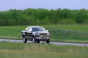 Fototapeta premium Rural road scene with pickup truck and bull bar