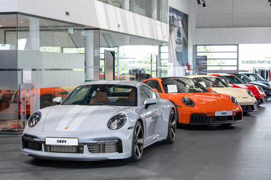 Roost Bissen, Luxembourg - June 22nd 2026 : View on a grey Porsche 911 Sport Classic finished in Sport Grey Metallic in a showroom with other Porsches behind.