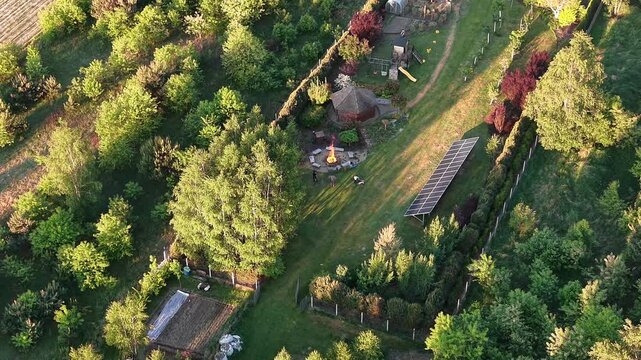 Backyard leisure area with fire pit in golden light