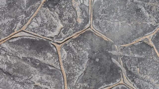 Slow Vertical Pan Across Grey Stone Paving Texture Background