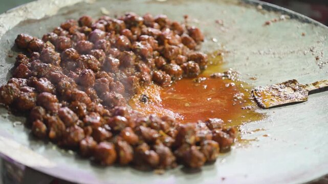 Manchurian Cooking on Hot Griddle, Street Style Veg Manchurian Preparation, Indo Chinese Manchurian on Tawa, Spicy Manchurian Street Food stock video.