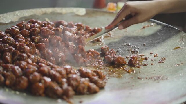 Manchurian Cooking on Hot Griddle, Street Style Veg Manchurian Preparation, Indo Chinese Manchurian on Tawa, Spicy Manchurian Street Food stock video.