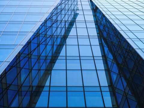 Modern building exterior Glass facade Low angle view Architecture details Business background