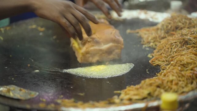 Butter Toasting Pav on Hot Tawa, Street Vendor Cooking Butter Pav, Indian Street Food Butter Pav, Pav Roasting with Butter stock video.