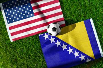 Obraz premium United States vs Bosnia and Herzegovina, national flags before international football tournament Round of 32 match, football on grass with ball, Santa Clara, California, USA, July 1, 2026