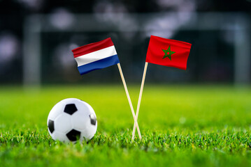 Fototapeta premium Netherlands vs Morocco, national flags before international football tournament Round of 32 match, football on green grass with goal in the background, Guadalupe, Nuevo León, Mexico, June 29, 2026