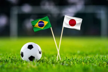 Fototapeten Pony Brazil vs Japan, national flags before international football tournament Round of 32 match, football on green grass with goal in the background, Houston, Texas, USA, June 29, 2026  © kovop58