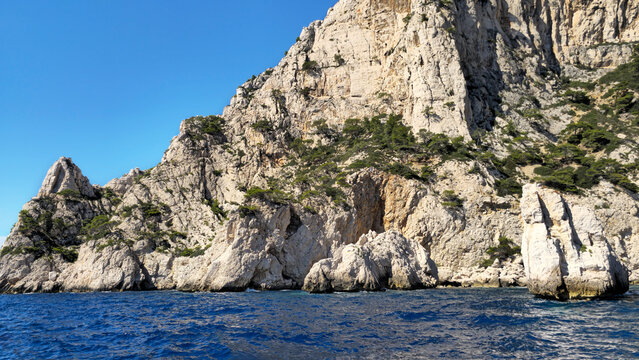 Calanque du Devenson cliffs rising from Mediterranean sea, Provence-Alpes-Cote d'Azur, France, Europe. 