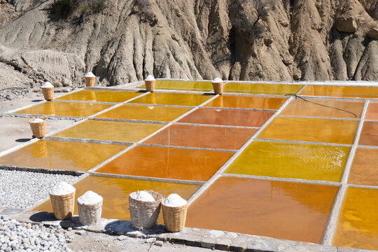 Harvesting salt at traditional mountain salt flats
