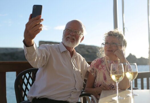 Happy senior couple taking a selfie on a date