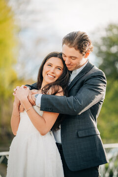 Young couple hugging outdoors celebrating love and commitment