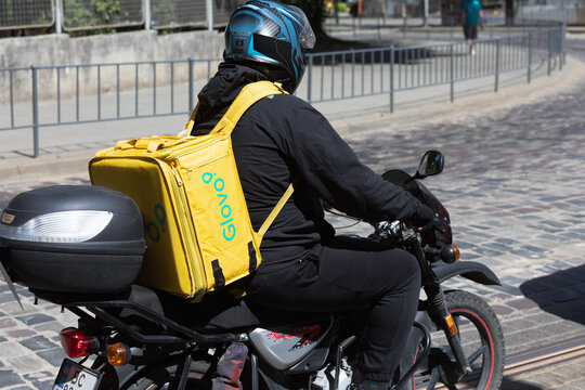 Courier Executing Express Food Delivery In Lviv Ukraine