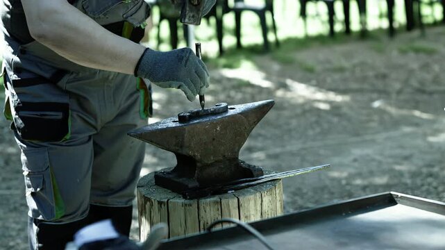 Blacksmith Metalwork on Outdoor Anvil