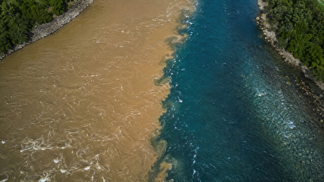 Aerial Landscape of Two Contrasting Rivers Joining Together
