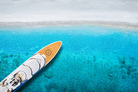 Summer holiday concept with a modern luxury yacht anchored at a paradise beach with turquoise sea and no people