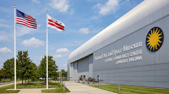Exterior view of the Steven F. Udvar-Hazy Center, a National Air and Space Museum facility in Chantilly, Virginia, featuring the Smithsonian logo, American flag, and vintage aircraft on display.