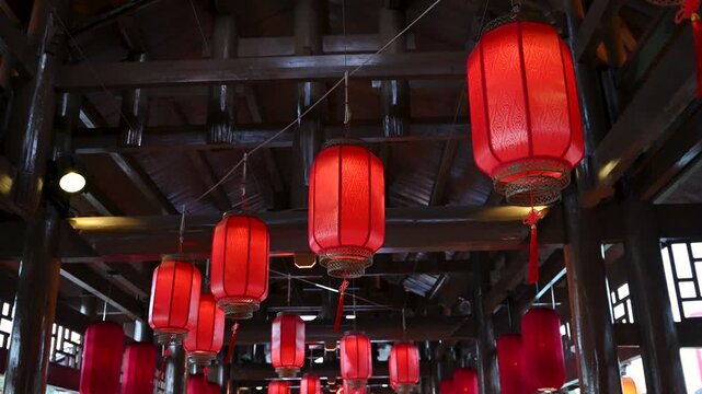 Chinese Red Lanterns Swaying in Traditional Setting