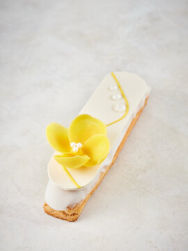 Lemon tart with floral decoration and shiny glaze, dessert for upscale cafe menu, special occasion treat