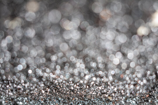Close-up view of shiny metallic texture with blurred background
