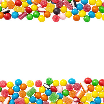 Vibrant, assorted candies like jelly beans, gumballs, and miniature hard candies form dense borders on a transparent studio background with copy space, cinema experience concept