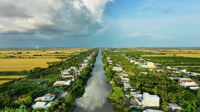 High angle view looking down at a straight silt river in the Mekong Delta