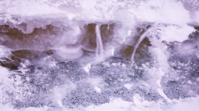 Overhead perspective of scattered ice formations covering the surface of the Great Lakes.