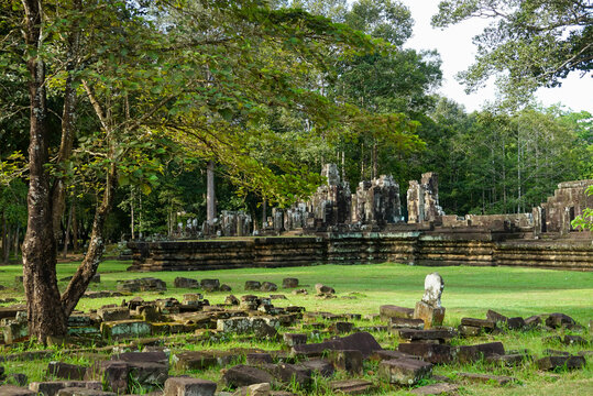 Ancient laterite ruins surrounded by trees in Angkor